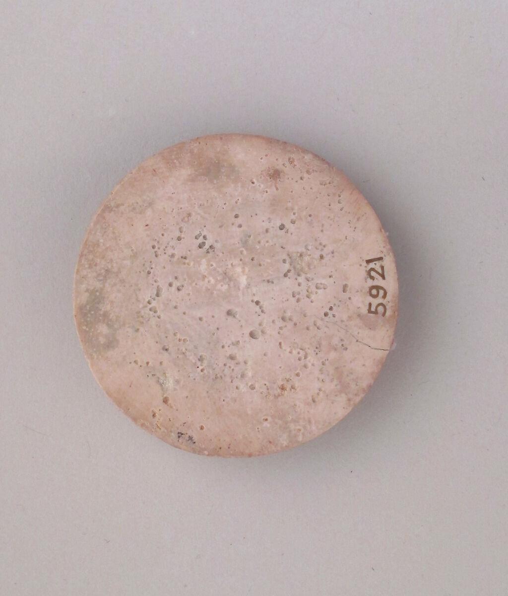 Ivory disk of a pyxis with rosette, Hippoptomus ivory, Cypriot 