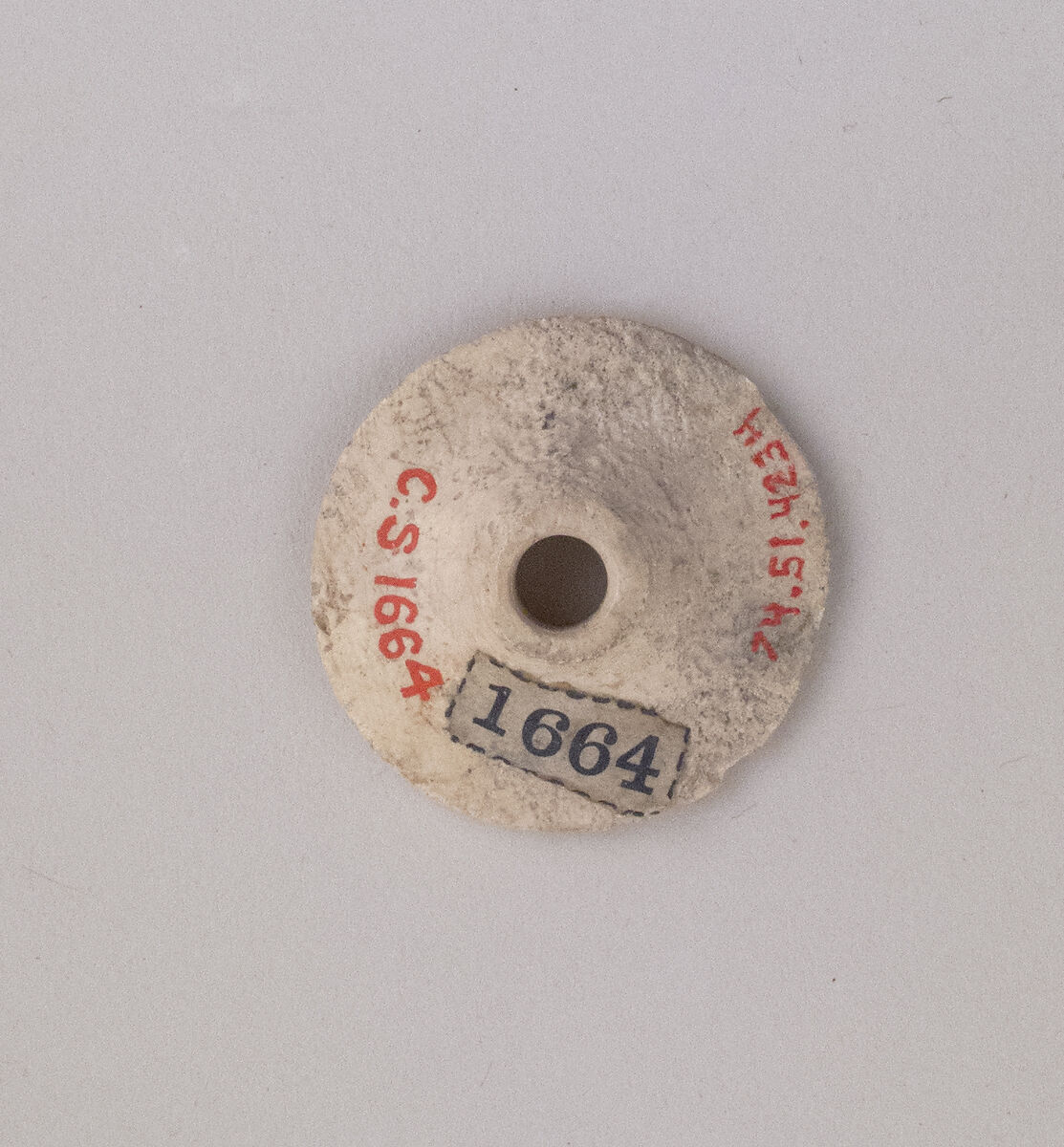 Ivory spindle whorl, Hippopotamus ivory, Cypriot