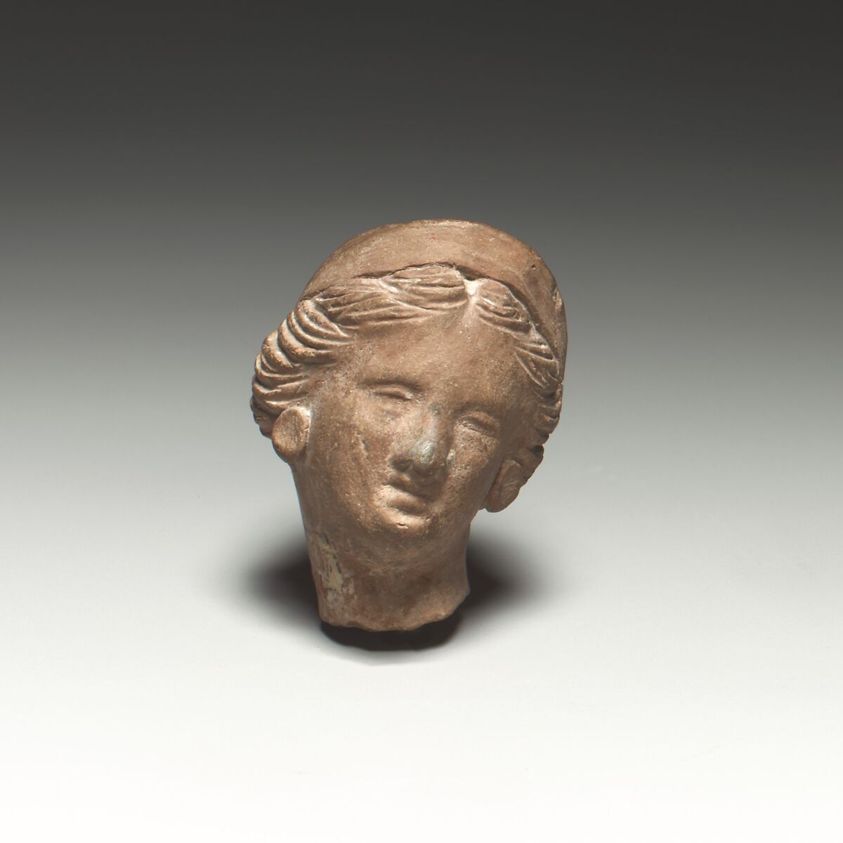 Terracotta female head, Terracotta, Greek, Asia Minor, Myrina (?) 