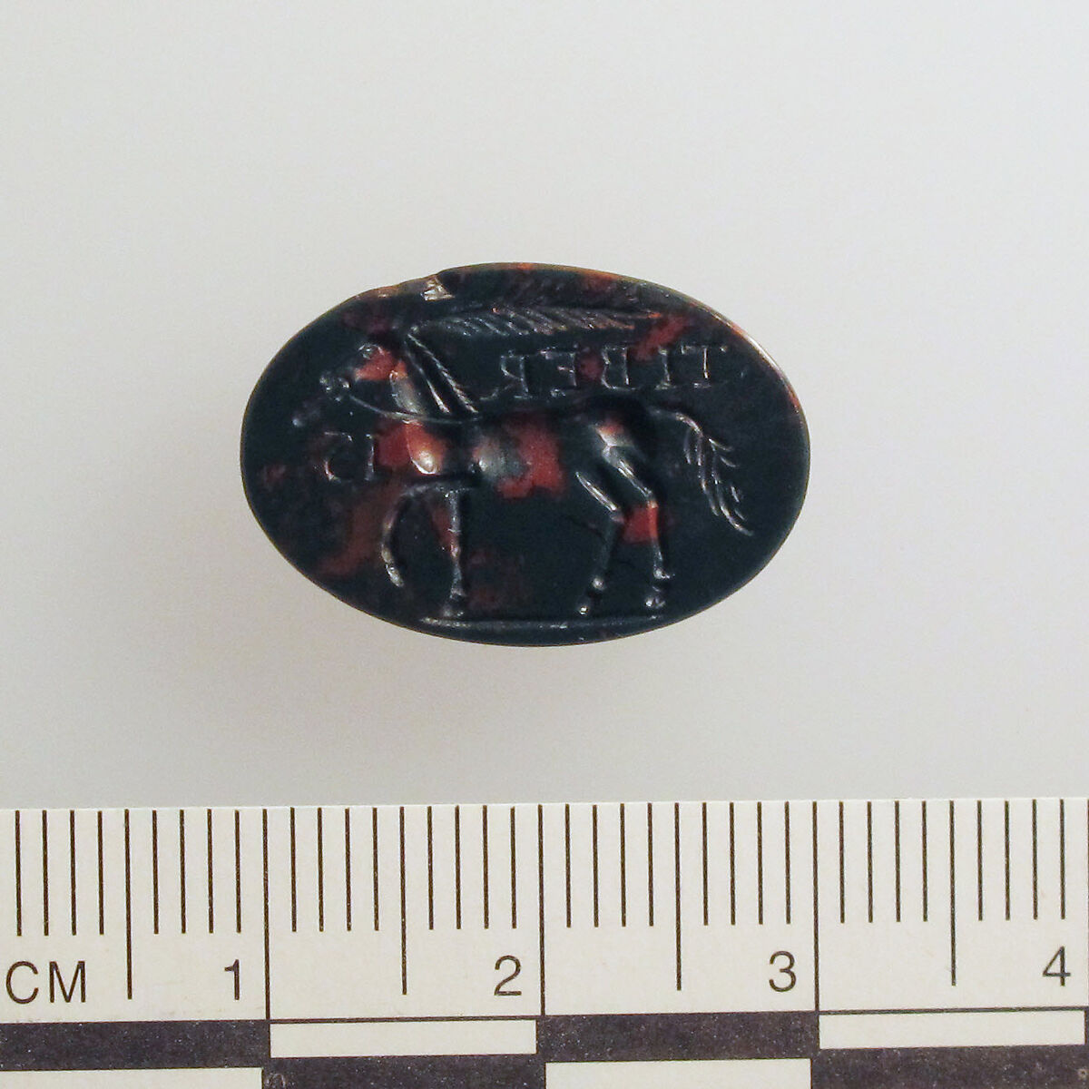 Heliotrope intaglio: Cock-headed anguipes, Heliotrope, Roman