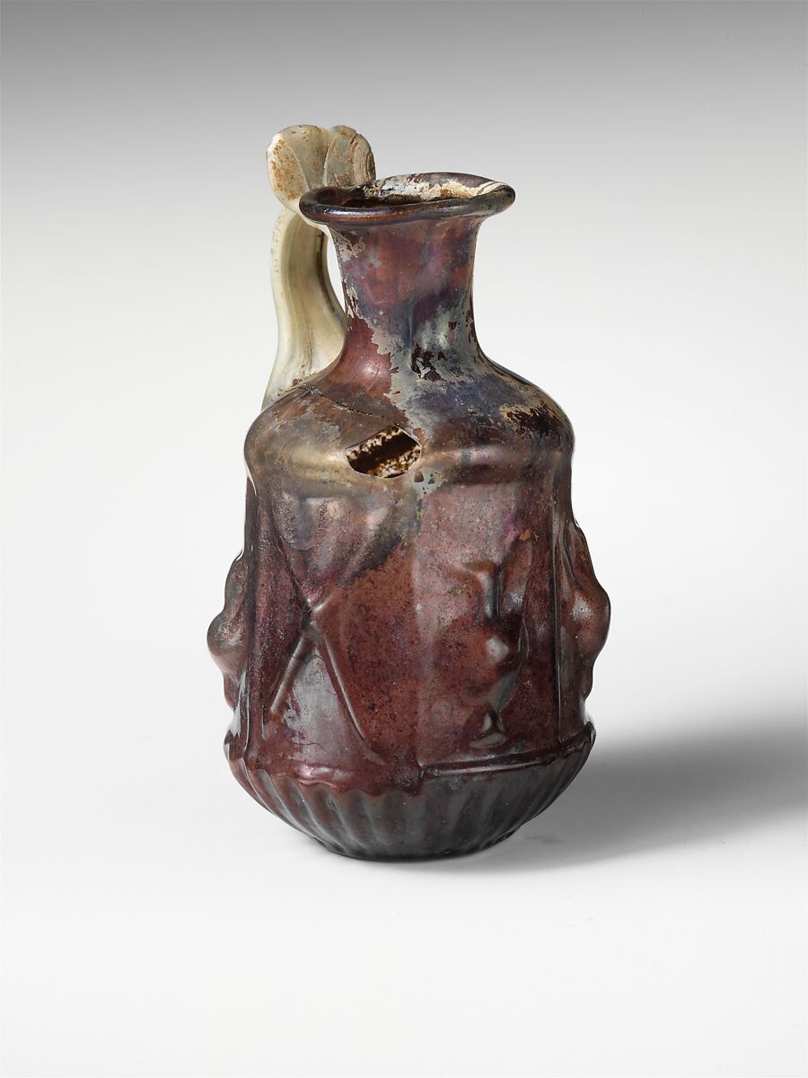 Glass hexagonal jug with Dionysiac symbols, Glass, Roman
