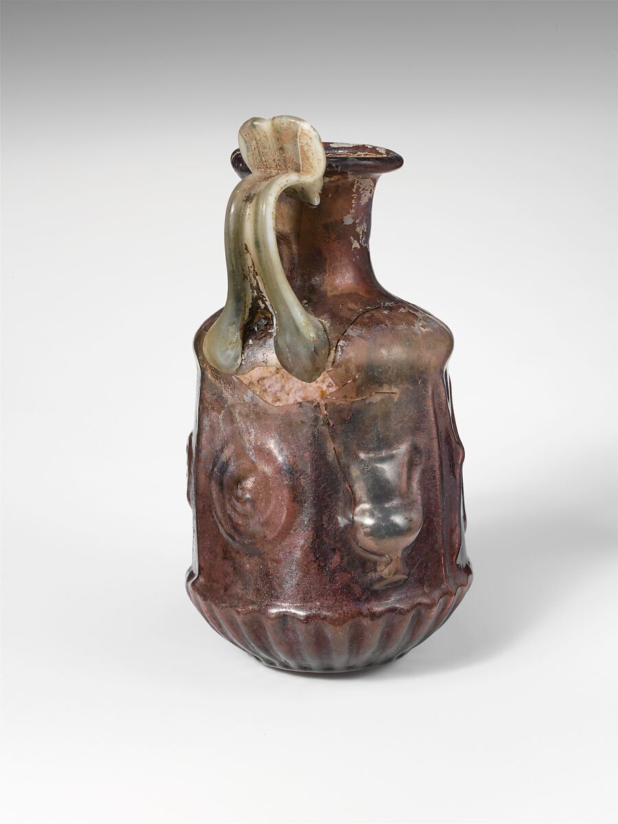 Glass hexagonal jug with Dionysiac symbols, Glass, Roman