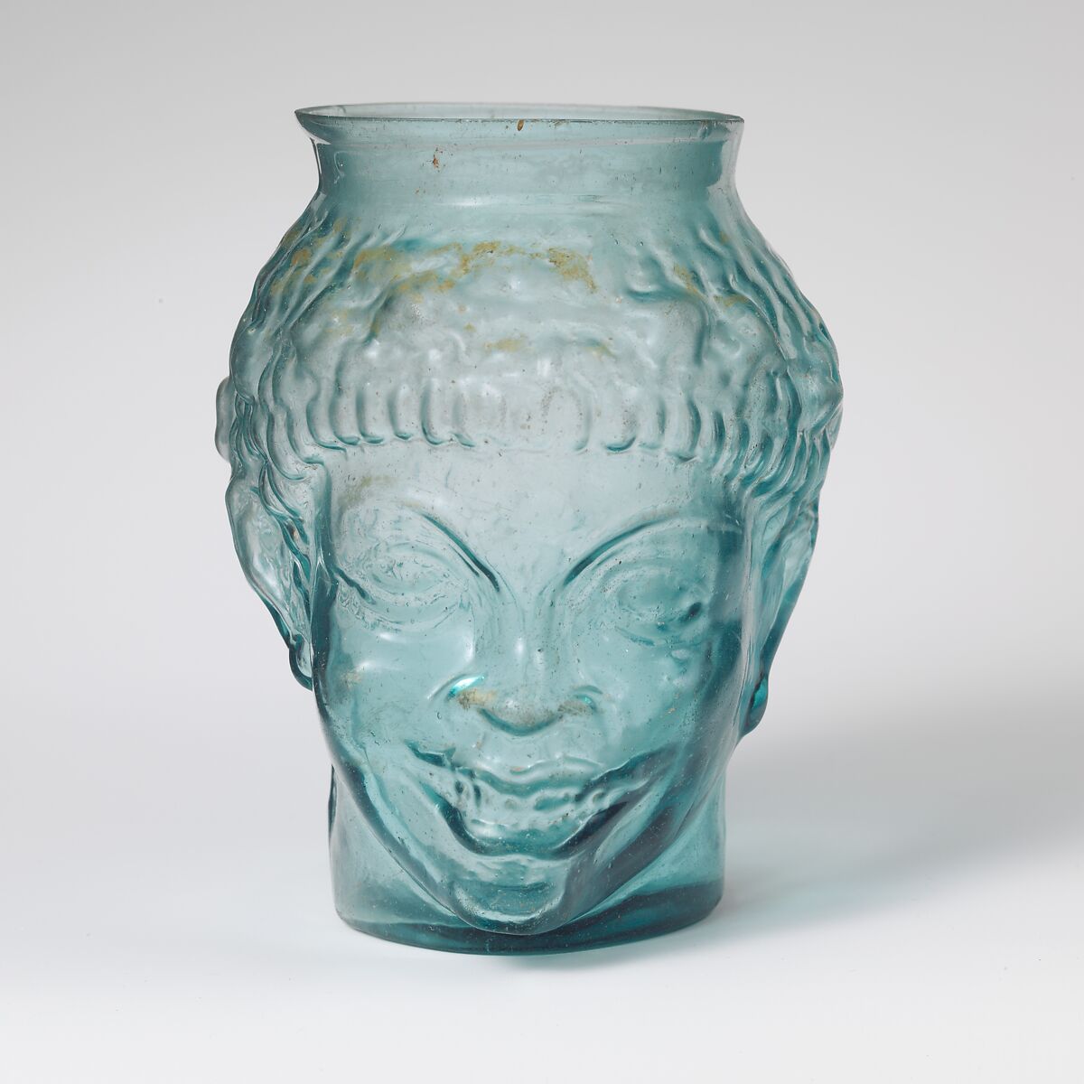 Glass cup in the form of the head of a Black African, Glass, Roman