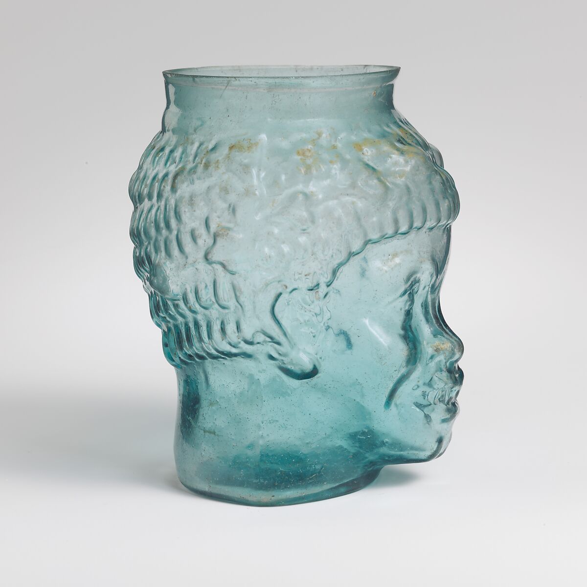 Glass cup in the form of the head of a Black African, Glass, Roman 