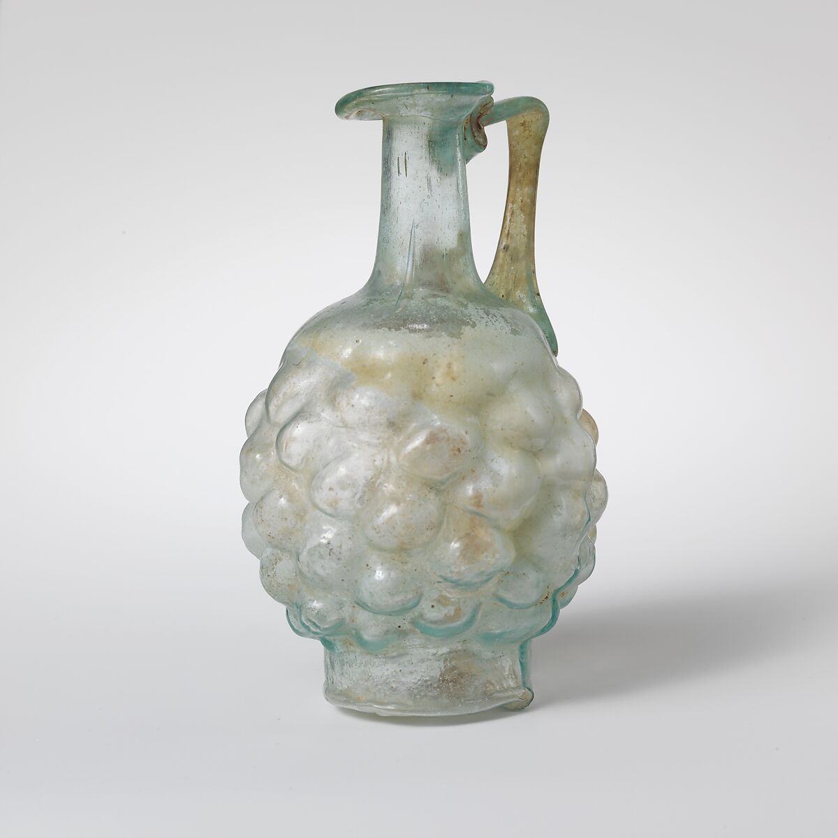 Glass jug in the form of a pine cone, Glass, Roman 