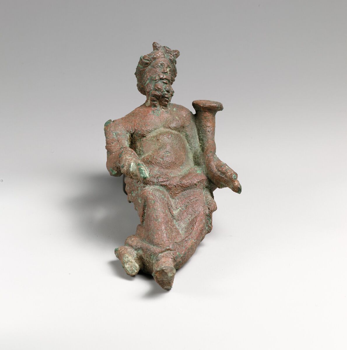 Bronze statuette of a god holding a cornucopia, Bronze, Greek or Roman 