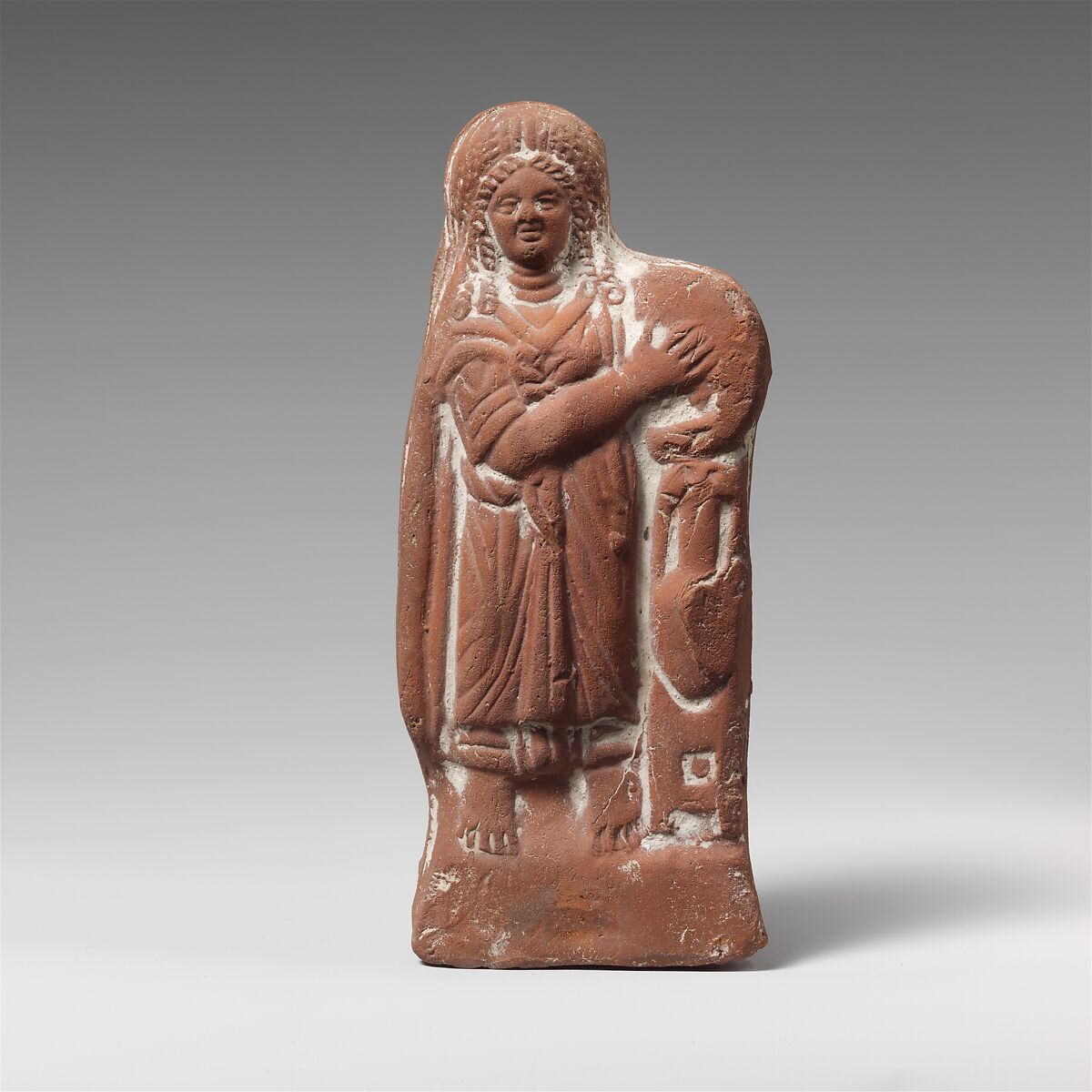 Terracotta statuette of a woman with tympanum, Terracotta, Roman, Egyptian 