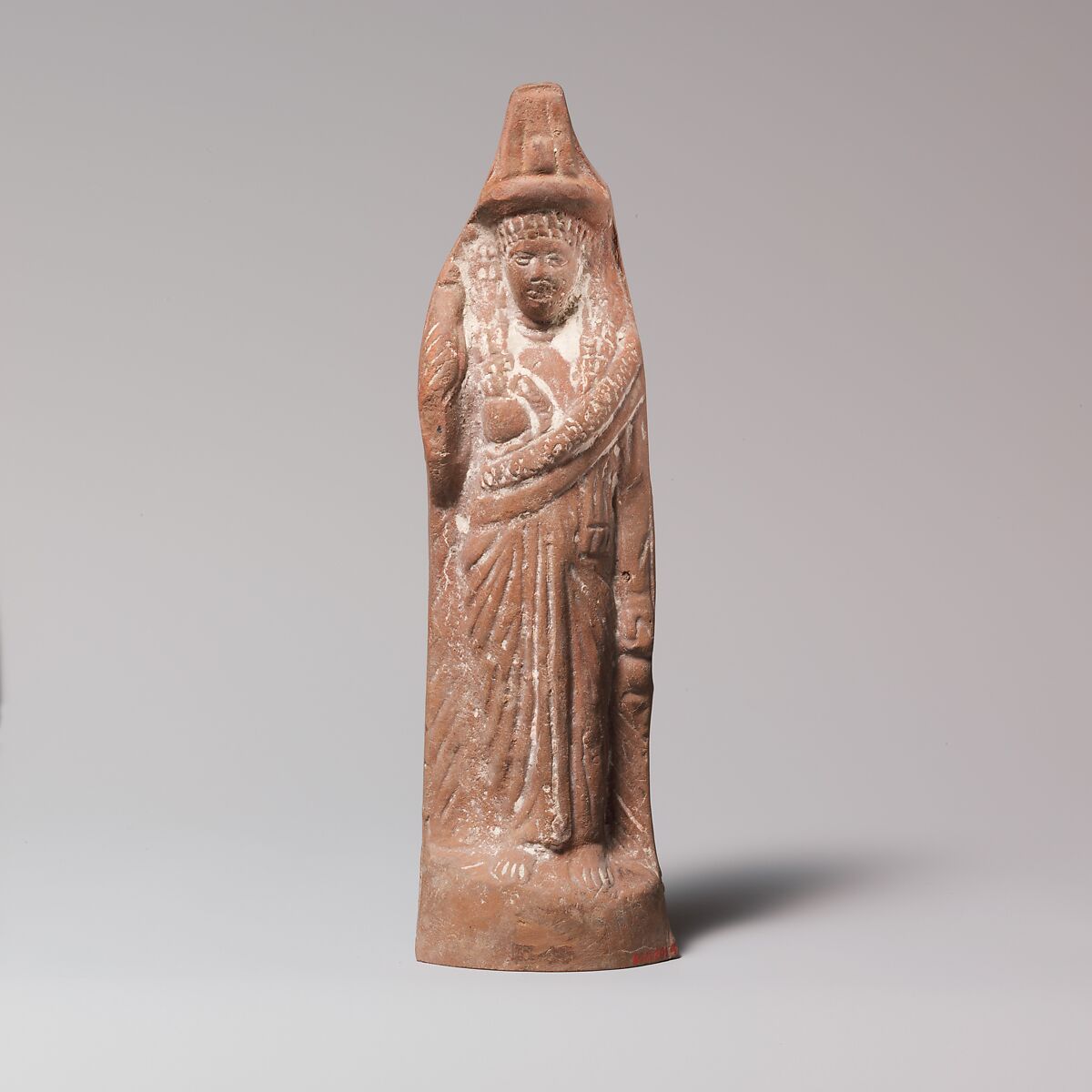 Terracotta statuette of Isis or a follower of her cult, Terracotta, Roman 