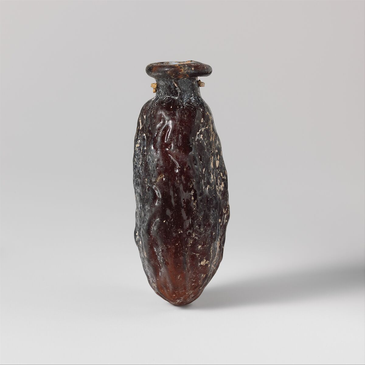 Glass bottle shaped like a date, Glass, Roman