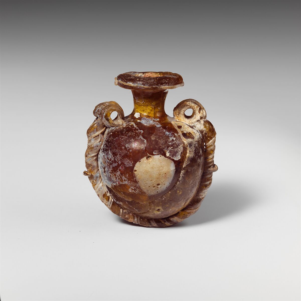 Glass lentoid aryballos (perfume bottle), Glass, Greek