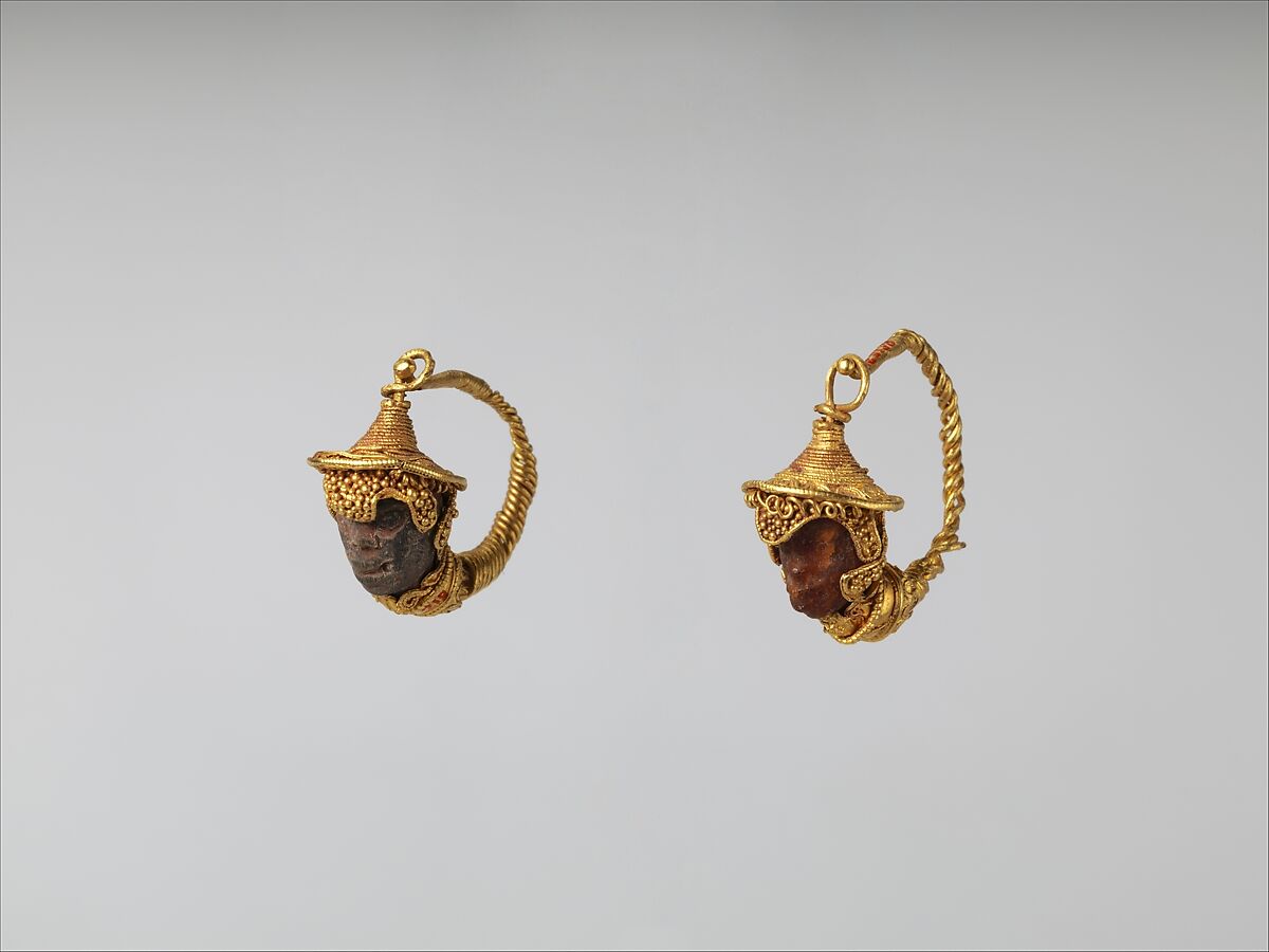Gold and amber earrings with head of a Black African youth, Gold, amber, Etruscan 