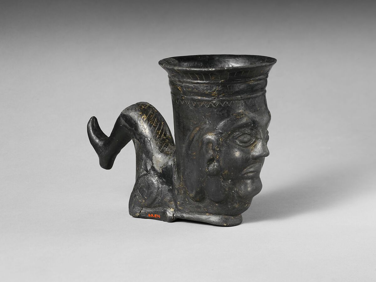 Terracotta vessel in the shape of a bent leg, Terracotta, Etruscan 