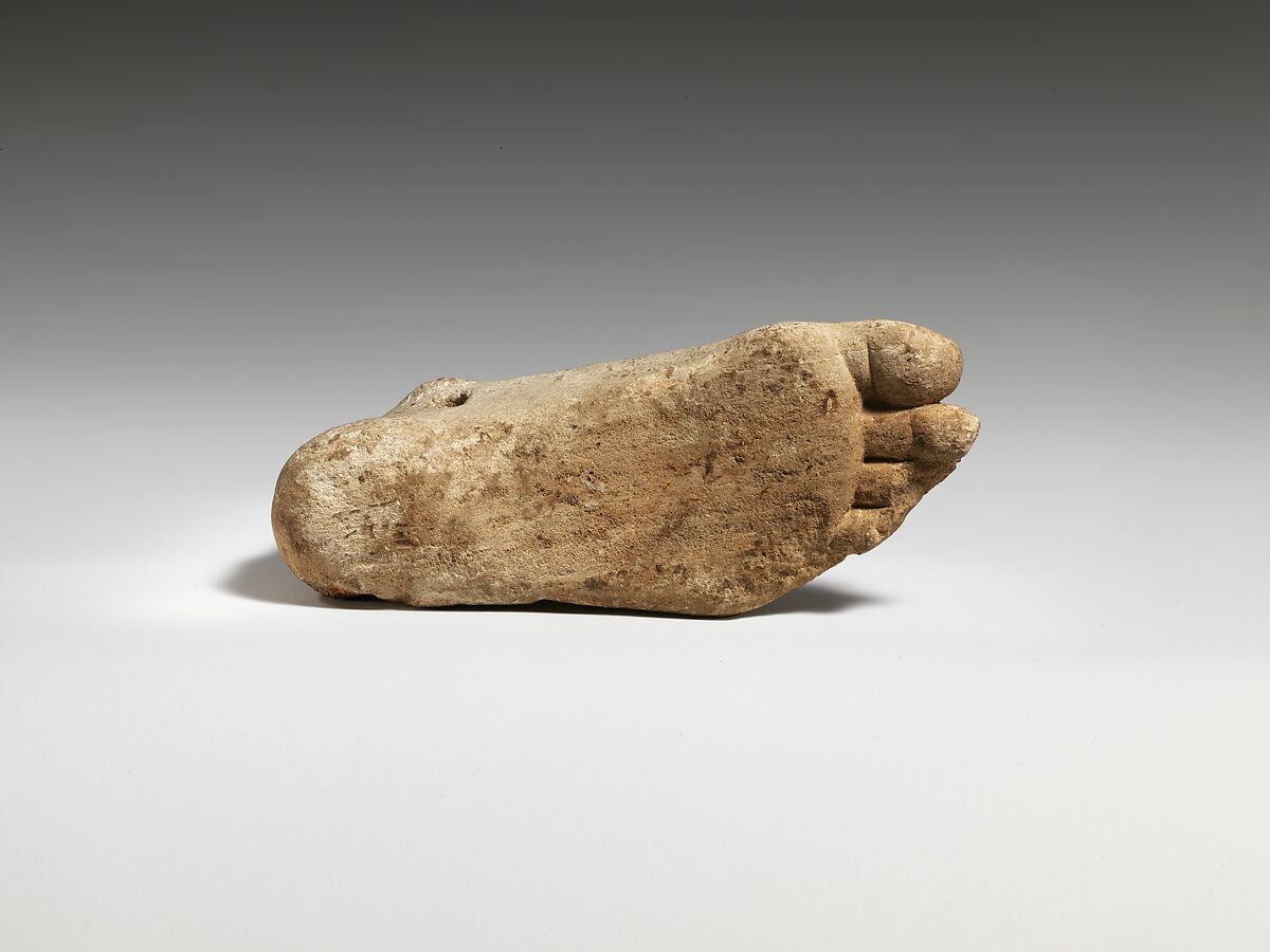 Limestone foot (left) with suspension hole, Limestone