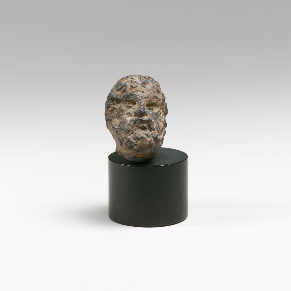 Bronze head of a bearded man or god, Bronze, Greek or Roman 