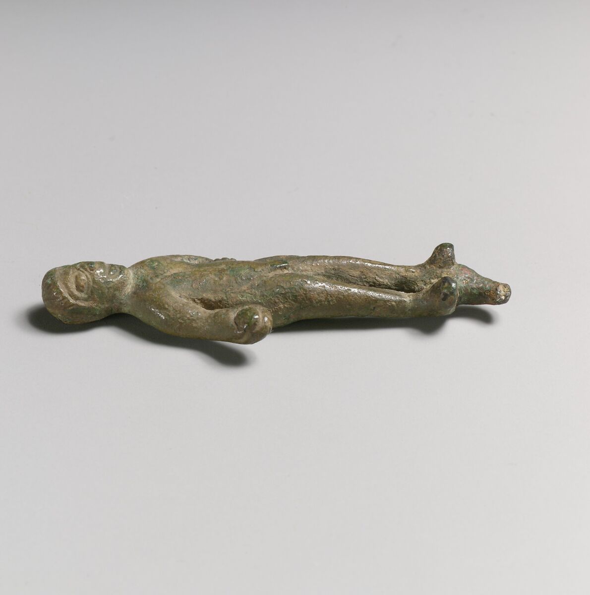 Statuette of a man with object in hand, Bronze, Italic 