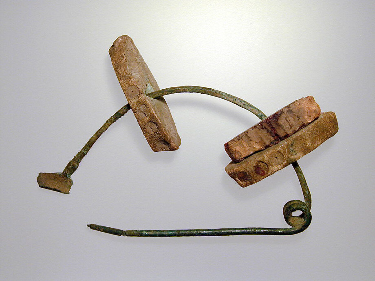 Bronze fibula (safety pin) with amber segments, Amber, bronze, Etruscan