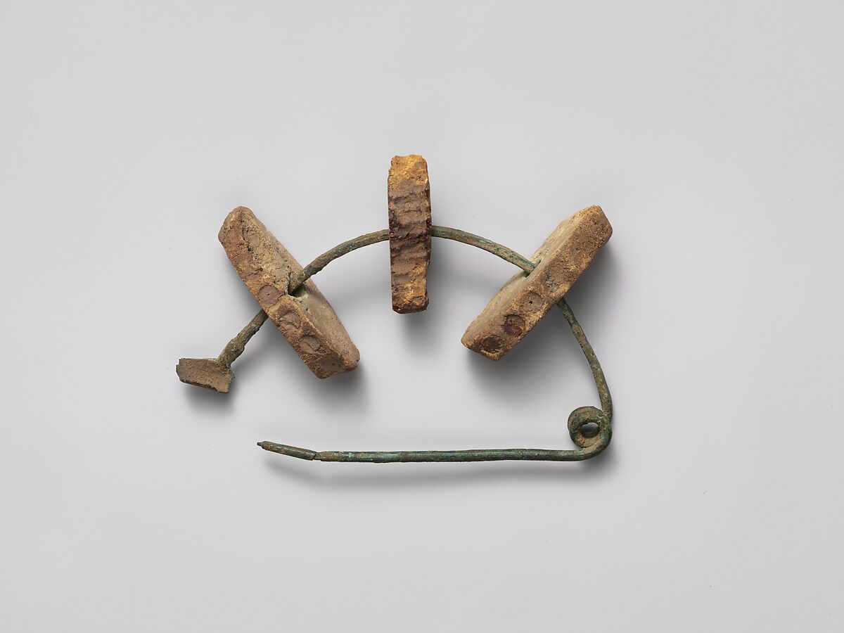 Bronze fibula (safety pin) with amber segments, Amber, Etruscan 