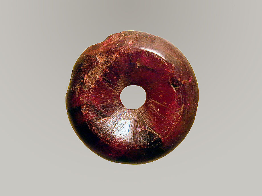 Pierced disk, perhaps from an earring or fibula (safety pin), Amber, Etruscan or Italic 