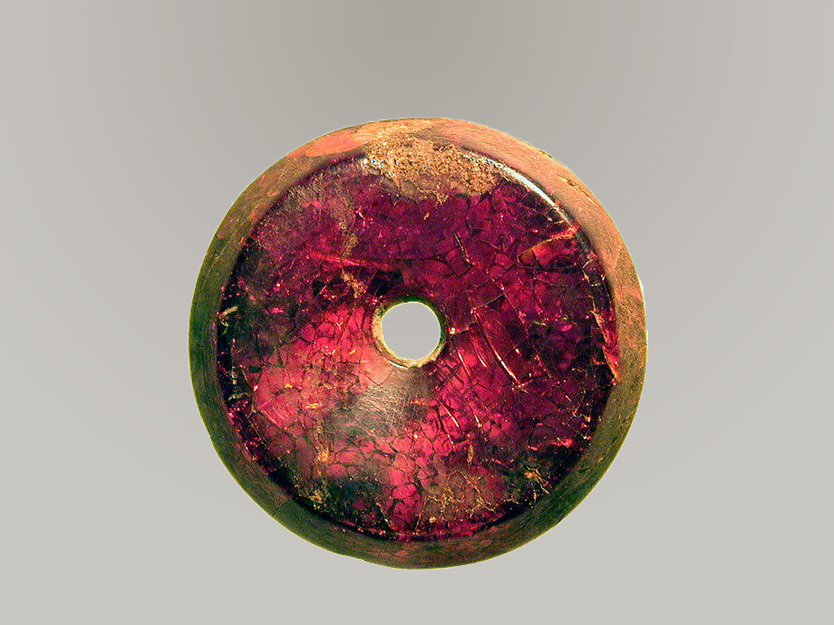 Pierced disk, perhaps from an earring or fibula (safety pin), Amber, Etruscan or Italic 