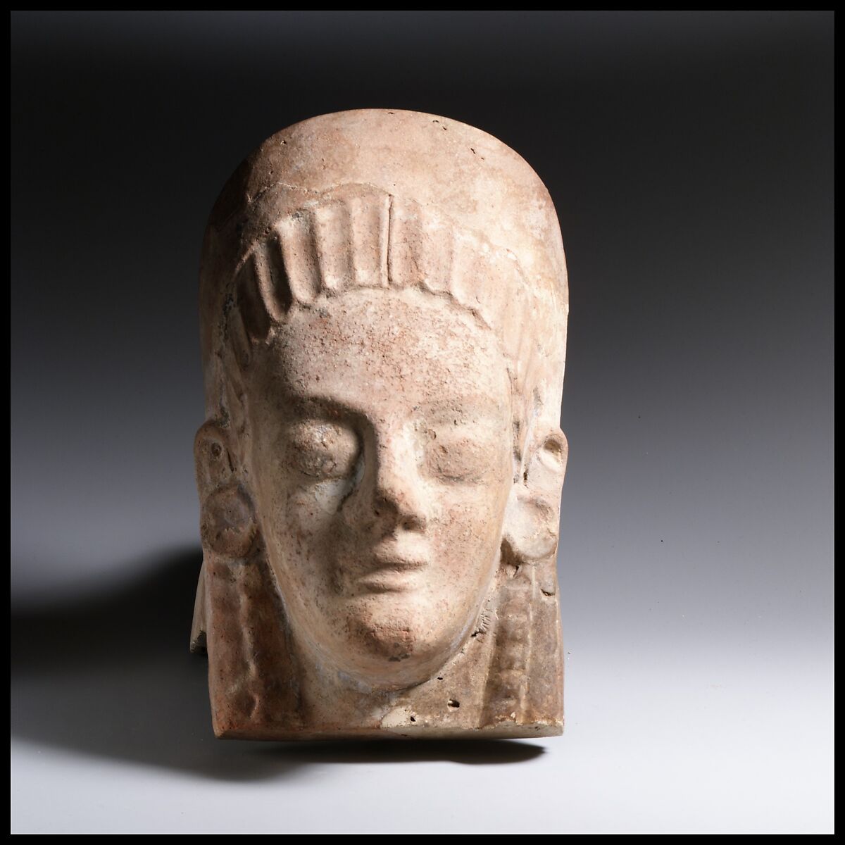 Terracotta antefix (roof tile) with head of a woman, Terracotta, Etruscan, Cerveteri 