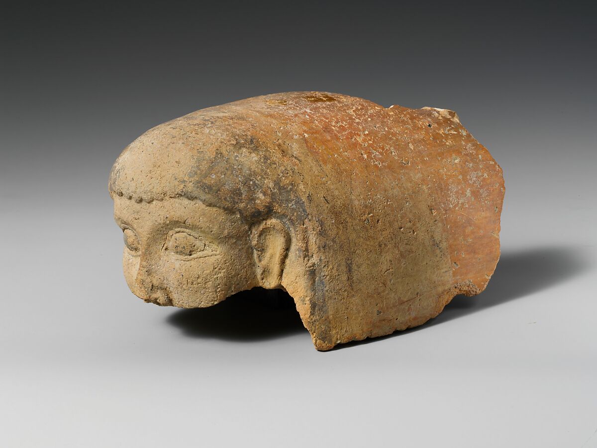 Terracotta antefix (roof tile) with female head, Terracotta, Etruscan, Cerveteri 