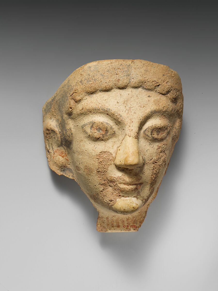 Terracotta antefix (roof tile) with female head, Terracotta, Etruscan, Cerveteri 