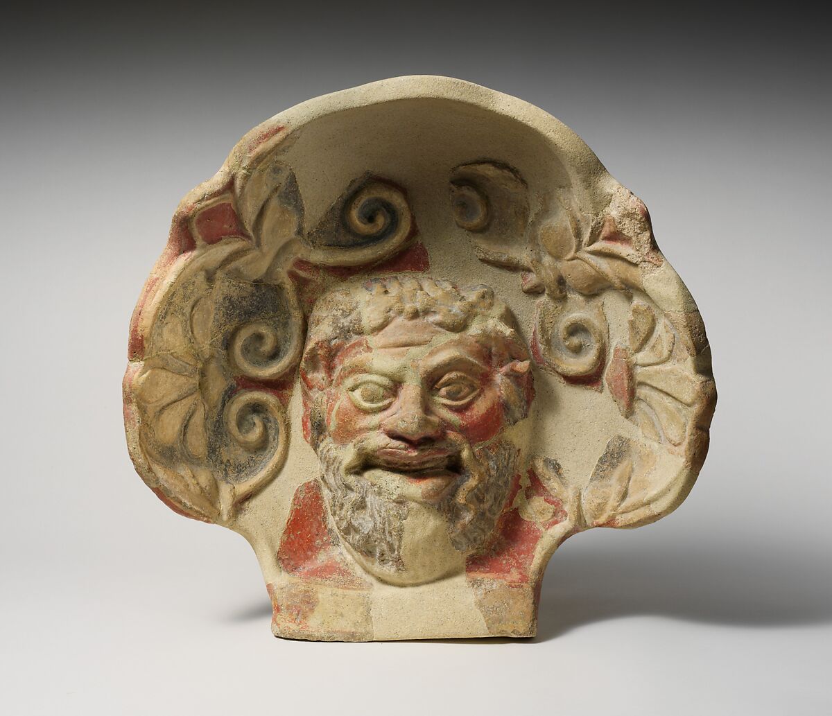 Terracotta antefix (roof tile) with head of a satyr, Terracotta, Etruscan, Cerveteri 