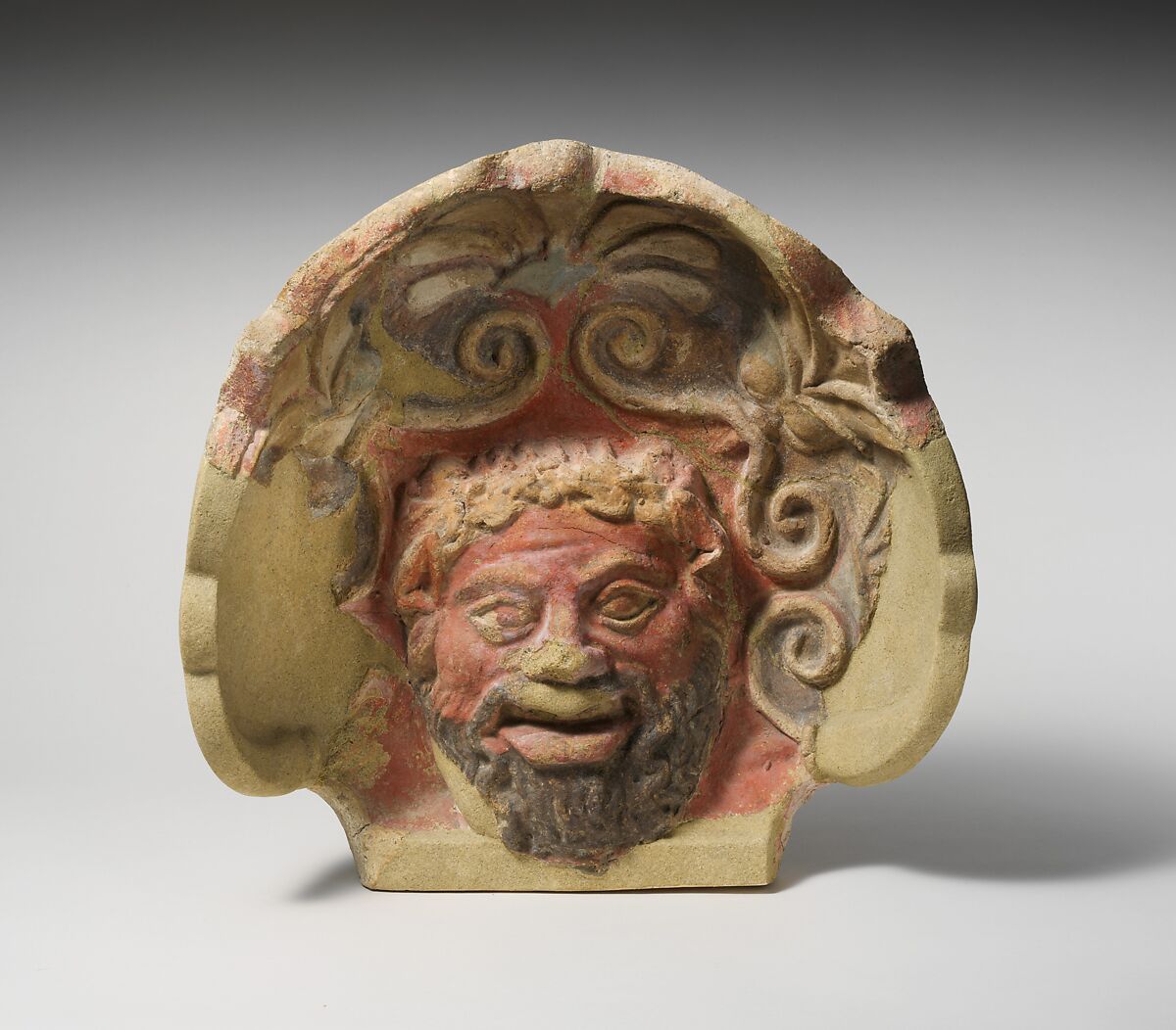 Terracotta antefix (roof tile) with head of a satyr, Terracotta, Etruscan, Cerveteri 