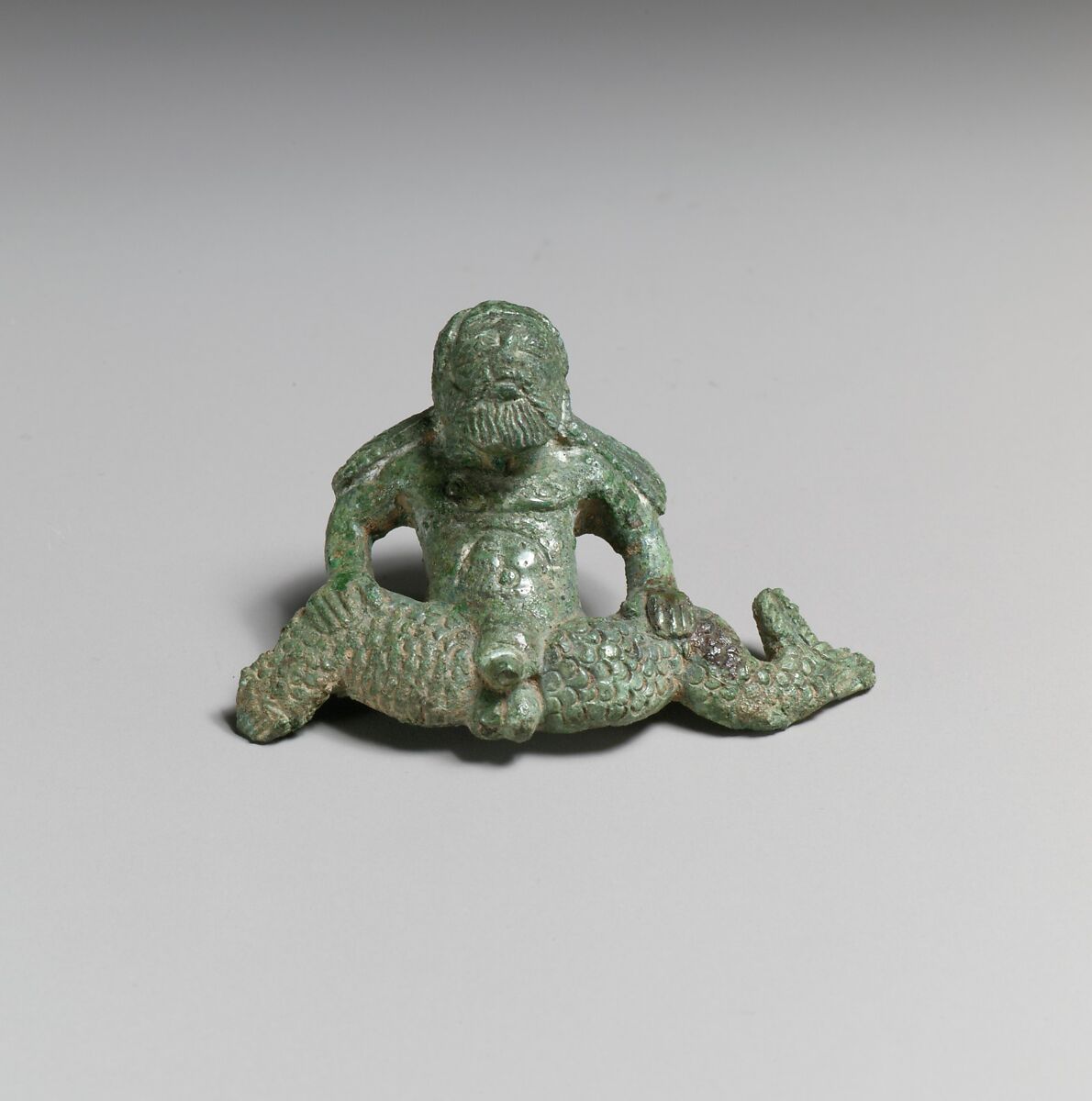 Bronze helmet attachment in the shape of a triton, Bronze, Etruscan 