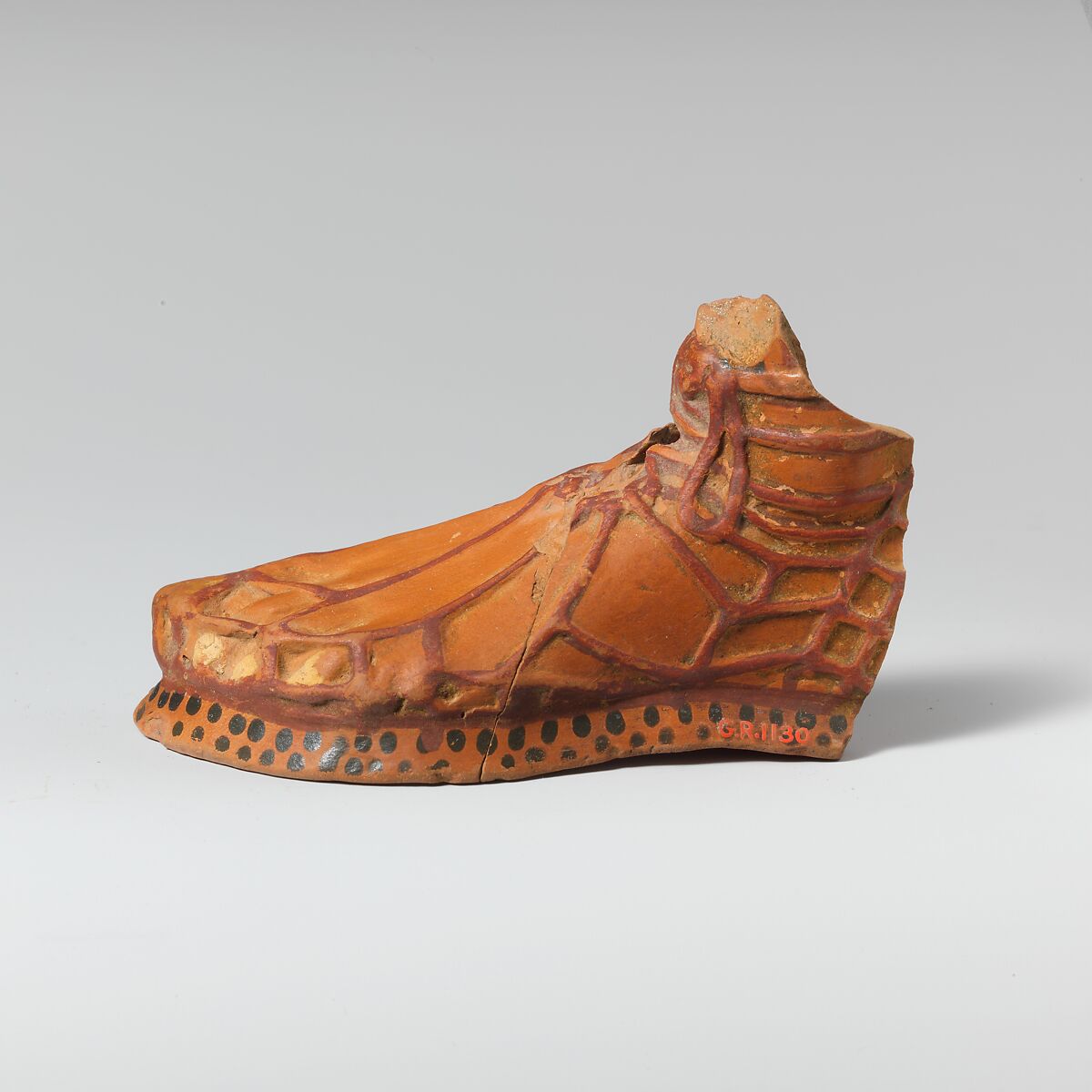 Terracotta aryballos in the form of a sandaled foot, Terracotta, East Greek 