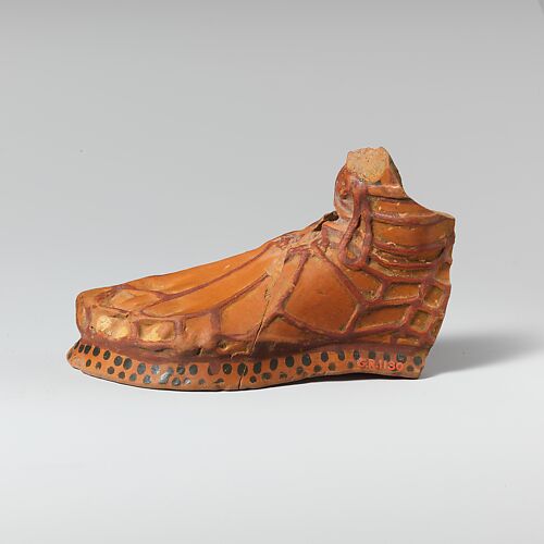 Terracotta aryballos in the form of a sandaled foot
