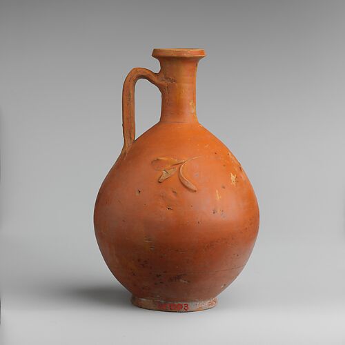Terracotta jug with barbotine decoration