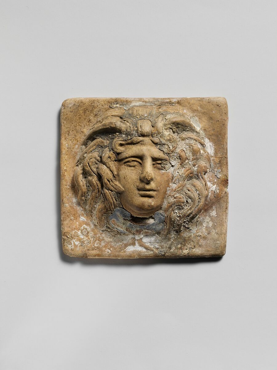 Terracotta relief plaque with head of Medusa, Terracotta, Greek 