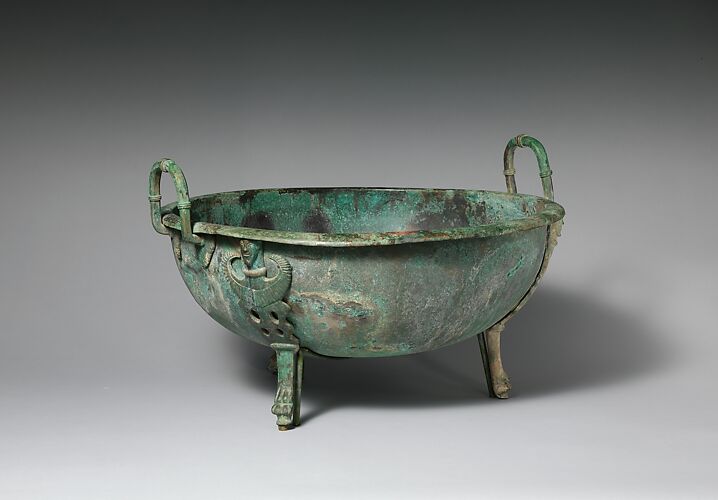 Bronze handled basin with three feet
