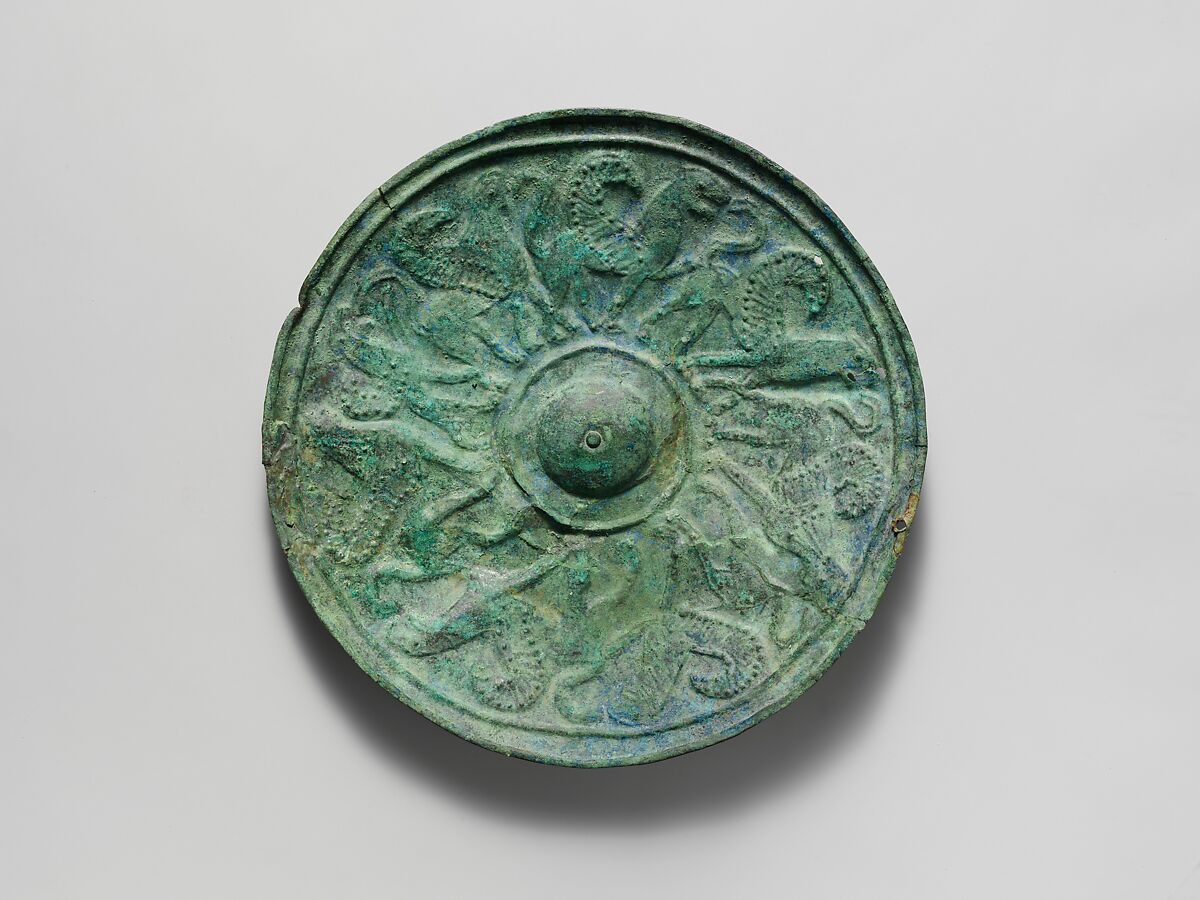 Bronze shield boss with griffin and sphinx frieze, Bronze, Etruscan 
