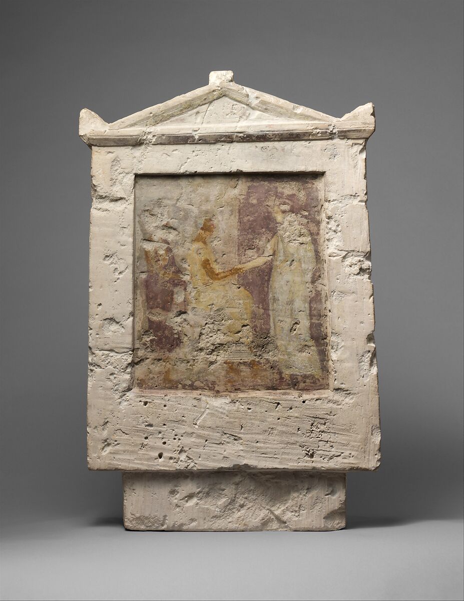 Painted limestone funerary stele with a seated man and two standing figures