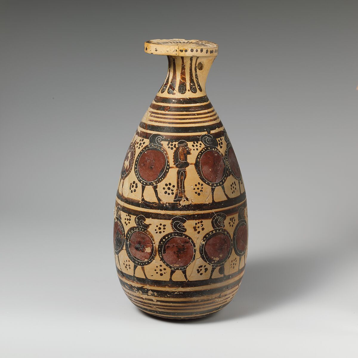 Terracotta alabastron (perfume vase), Attributed to the Late Warrior Frieze Vases, Terracotta, Greek, Corinthian 