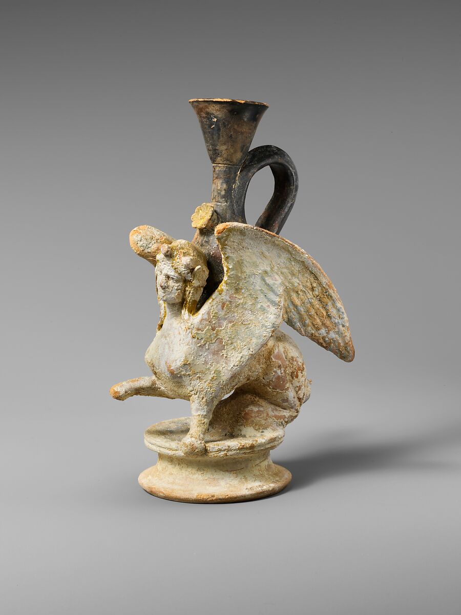 Terracotta lekythos (oil flask) in the form of a sphinx, Terracotta, Greek, Attic 