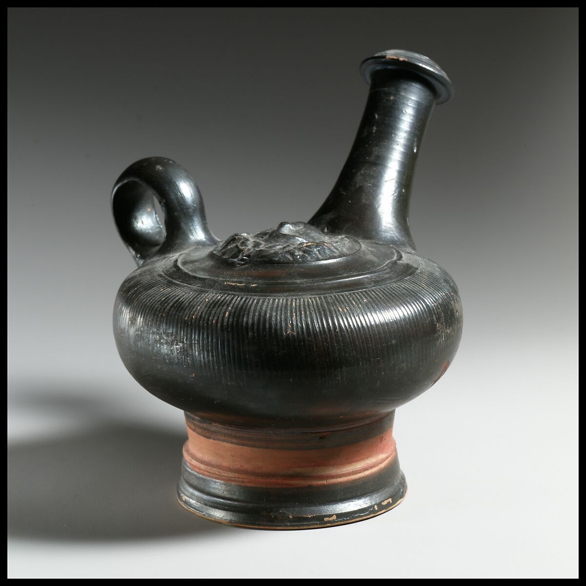 Terracotta guttus (flask with handle and vertical spout)