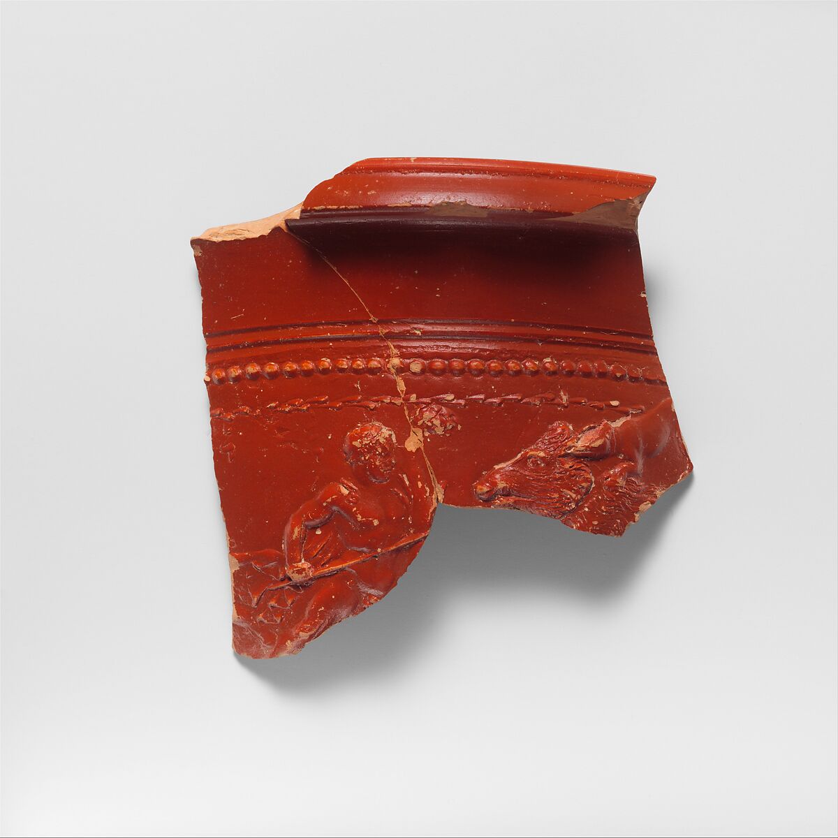 Terracotta bowl fragment depicting a boar hunt, Terracotta, Roman 