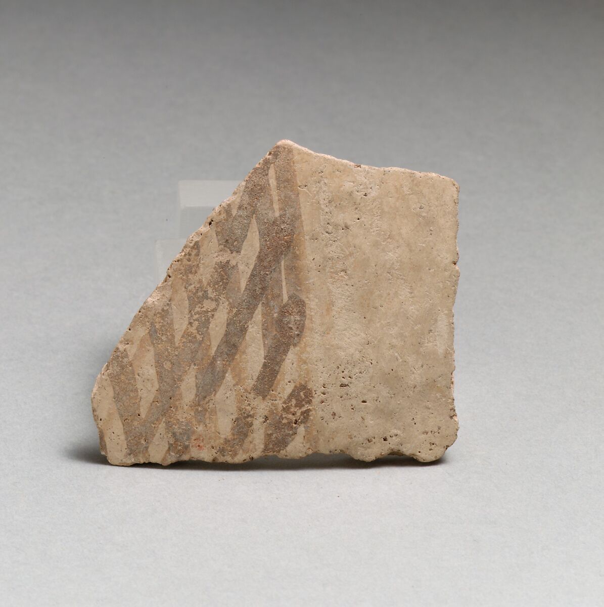 Terracotta vessel fragment with cross-hatched design, Terracotta, Minoan 