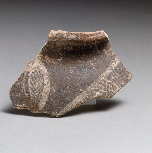 Terracotta rim fragment with cross-hatched lozenges