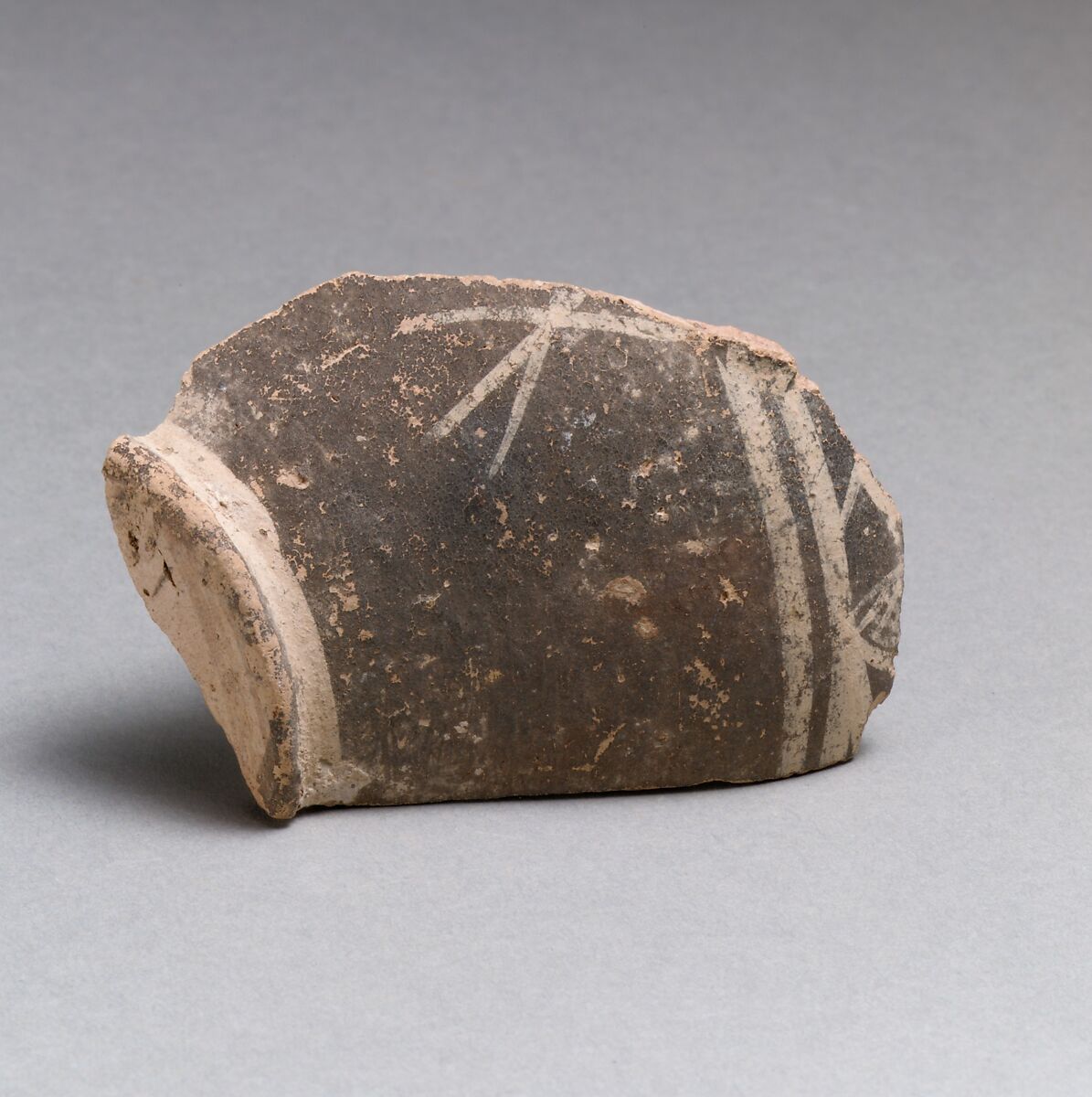Terracotta base of a small vase with linear decoration, Terracotta, Minoan 