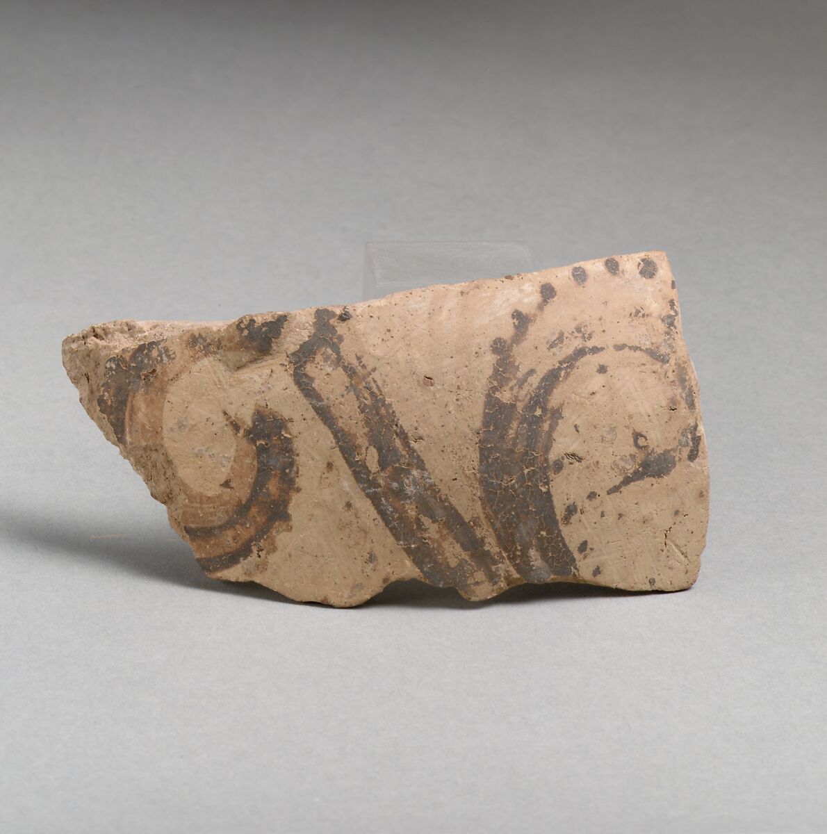 Terracotta vessel fragment with floral motif, Terracotta, Minoan 