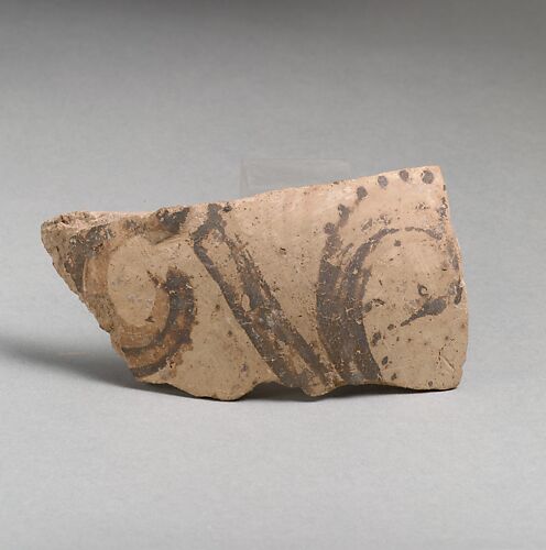 Terracotta vessel fragment with floral motif