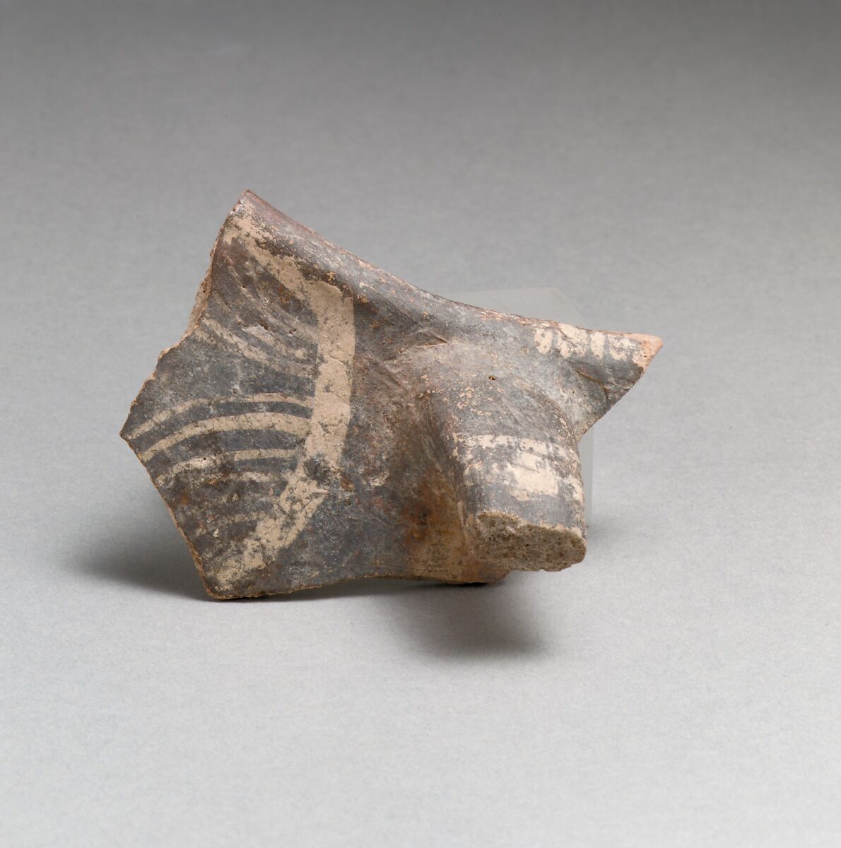 Terracotta rim and handle fragment from a jug, Terracotta, Minoan 