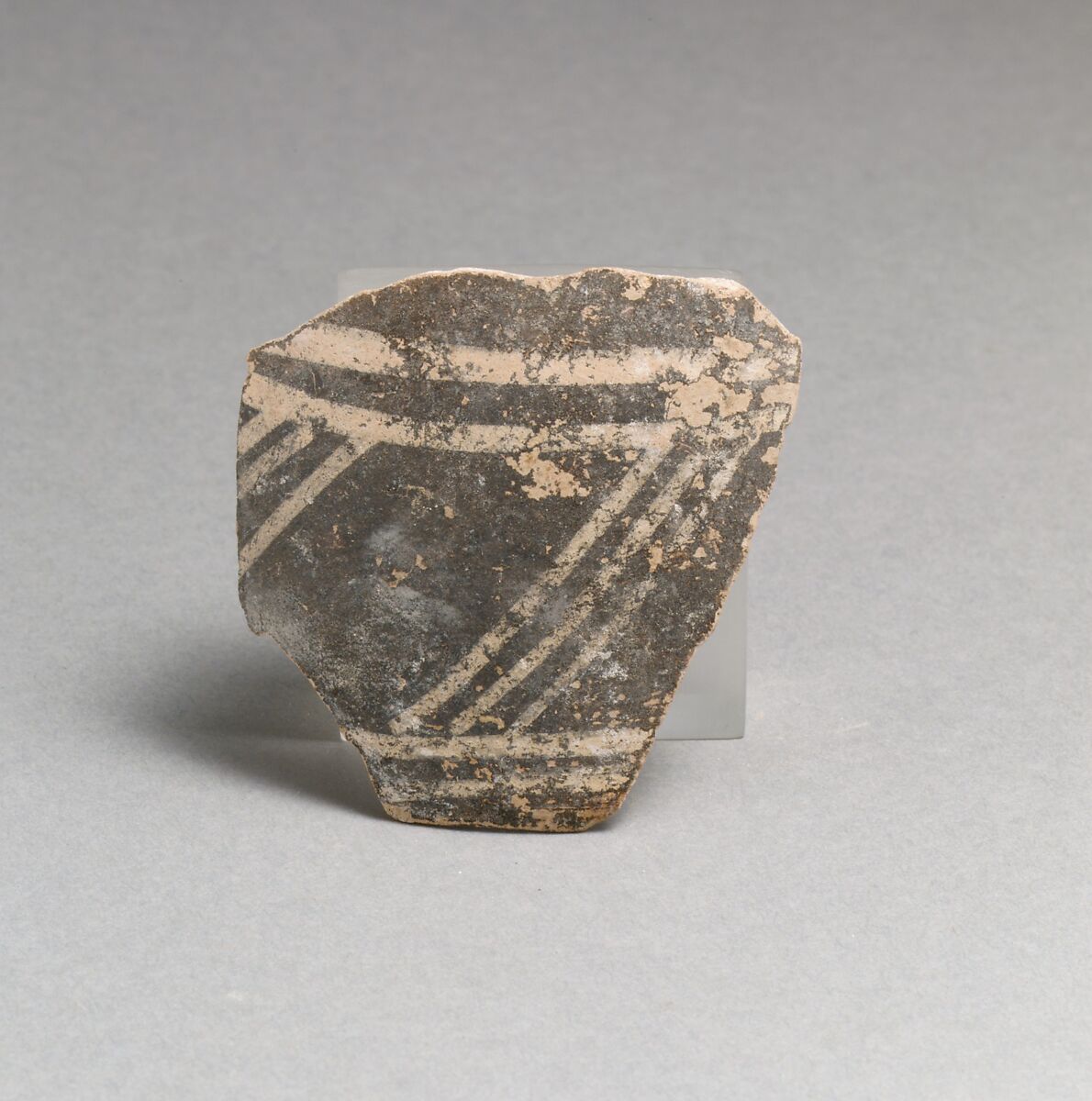 Terracotta rim fragment with triglyph and metope motif, Terracotta, Minoan 