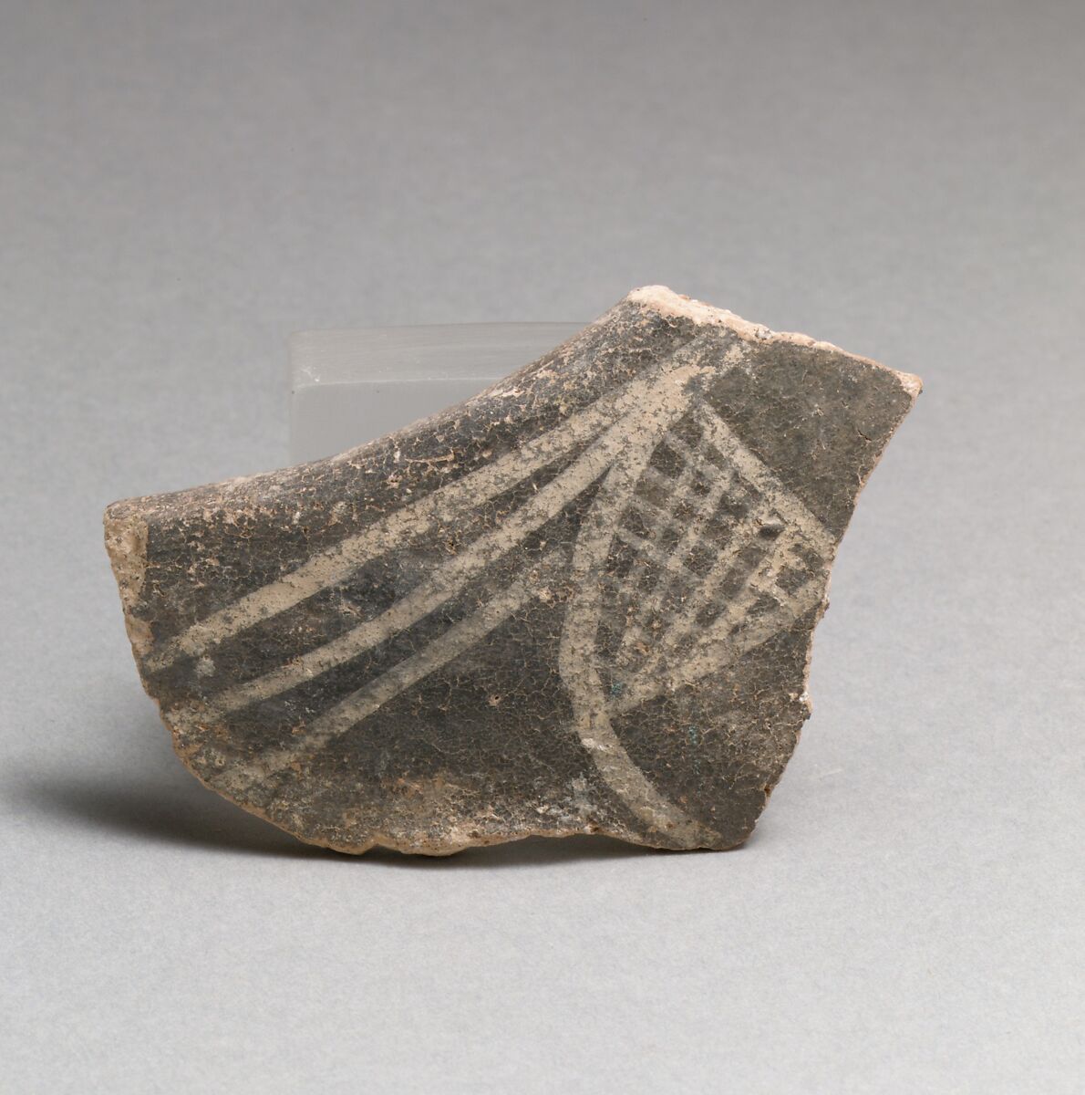 Terracotta rim fragment with hatched triangle, Terracotta, Minoan 