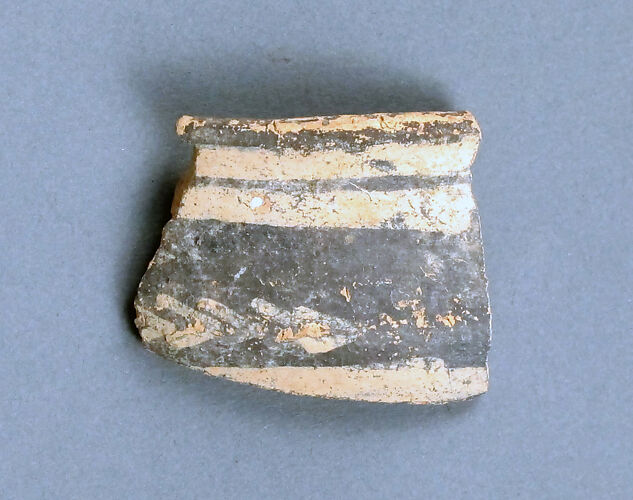 Terracotta rim fragment with linear motifs