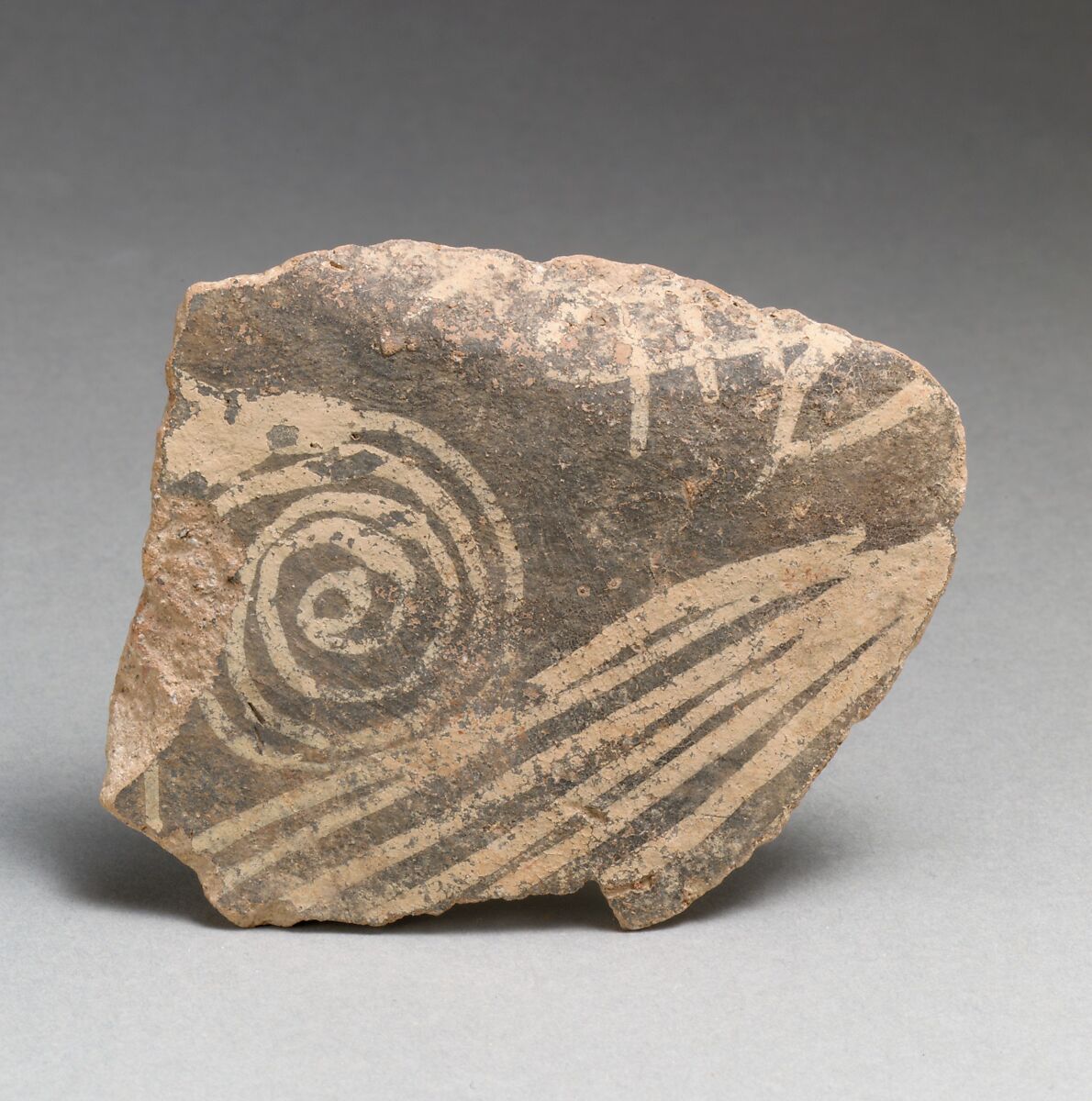 Terracotta vessel fragment with spiral and linear motifs, Terracotta, Minoan 